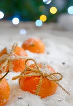 Christmas composition with mandarins in snow 