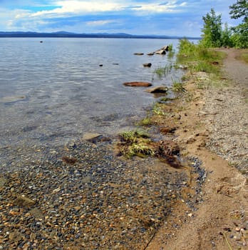 Crystal clear water of Lake Uwildy in Southern Urals in summer