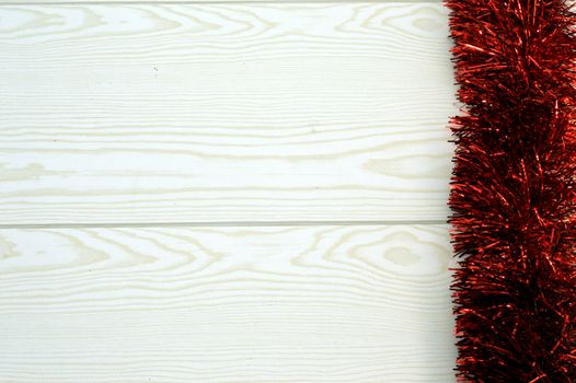 Vertical red garland on wooden background