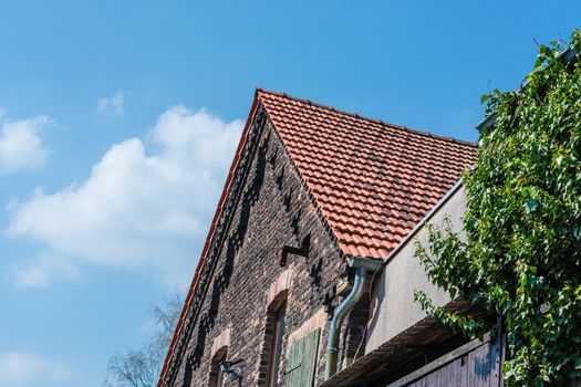 House with stone gable made of brick in Germany.