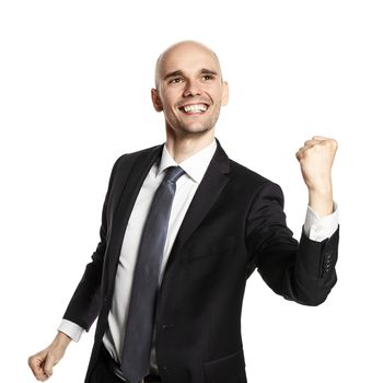 Studio portrait of a young man in a gesture of victory. Studio shot isolated on white background.