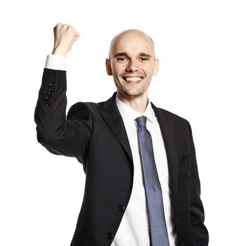 Portrait of smiling young man celebrating his success. Studio shot isolated on white.