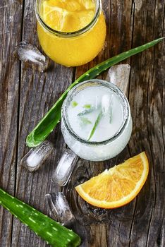 glass of medicinal drink sap from aloe leaf and orange