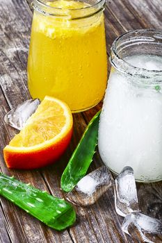 glass of medicinal drink sap from aloe leaf and orange