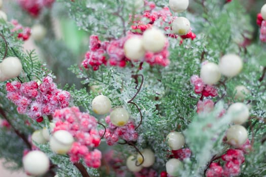 Christmas and New Year winter seasonal snow tree with pink and white berries