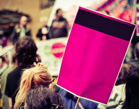 Busy Street Protest March With A Blank Sign For Your Text