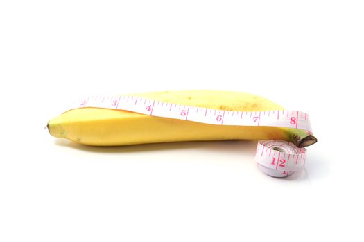 banana with measurement tape men penis size concept on white background