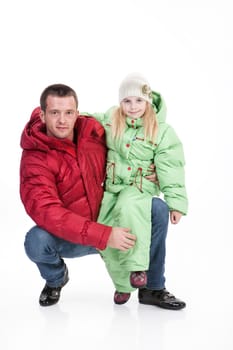 Young man and little girl in winter clothing on an isolated background