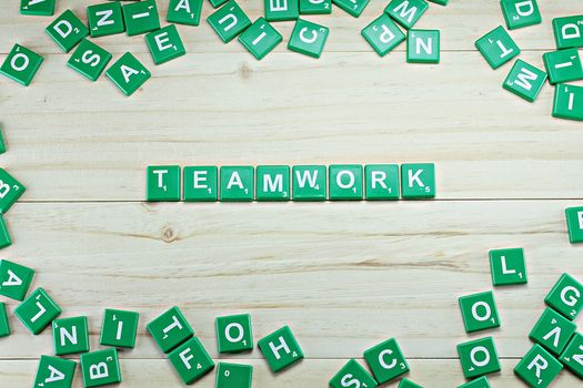 Concept of business : word teamwork on wood background