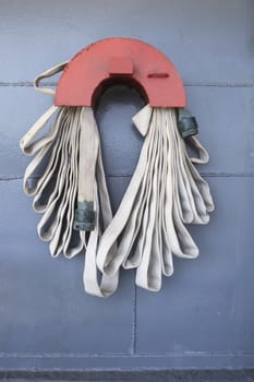 extinguishers tube line hanging on metal wall of military war ship use for safety object topic