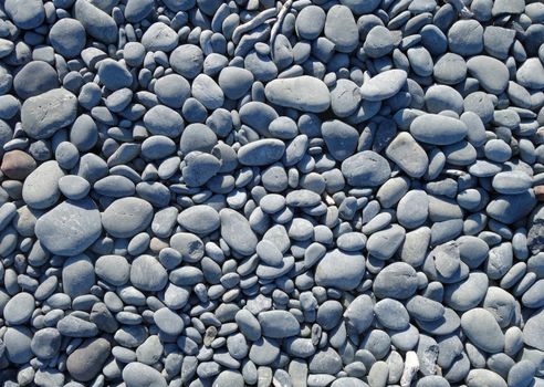 pebbles on a beach background texture wallpaper                               