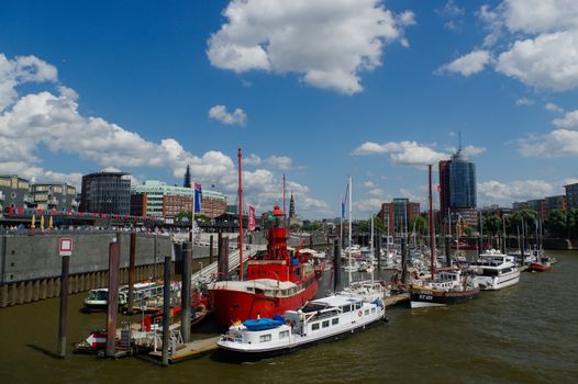 HAMBURG, GERMANY - JUNE 18, 2015: The Landungsbruecken of St. Pauli are a very attractive spot for tourists and visitors who enjoy sightseeing in combination with maritime atmosphere
