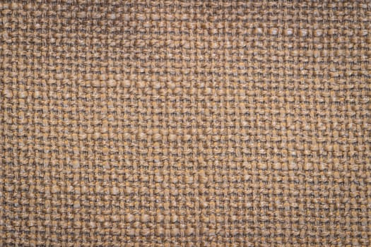 Rustic canvas fabric texture in beige color.