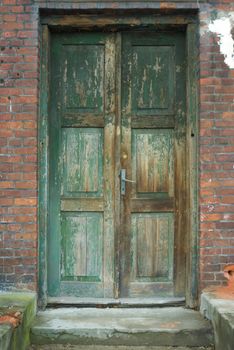 very old antique colored door of the building