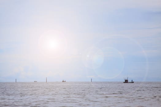 Fisherman and the sun with the sea background