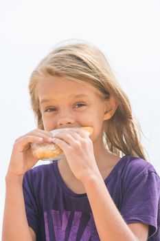 A hungry girl with an appetite for biting a delicious pie