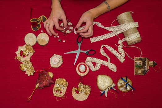 handmade Christmas decorations and toys on a red background