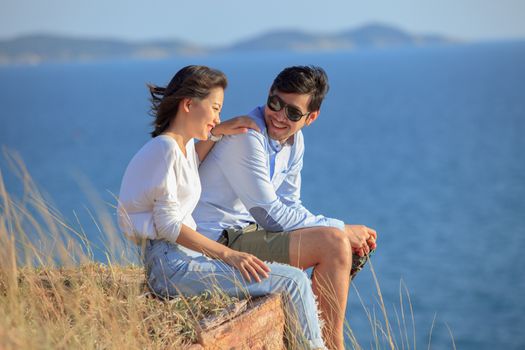 portrait of asian younger man and woman relaxing vacation at sea side happiness emotion