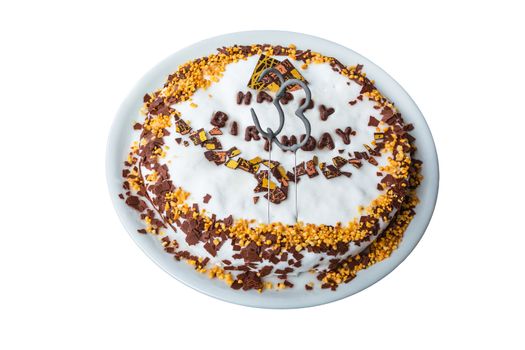 Birthday cake with candles and label in Happy Birthday against white background.