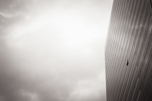 a part of modern business building against sky tone black and white plus vignette