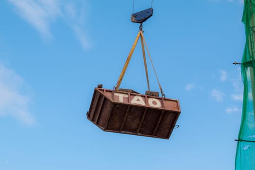 Construction site with cranes on sky background