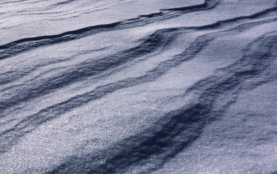 background of winter snow, shiny snowflake