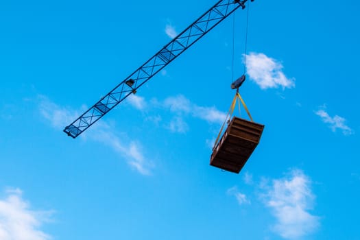 Construction site with cranes on sky background