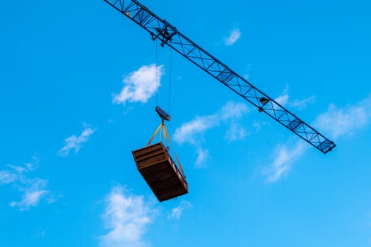 Construction site with cranes on sky background