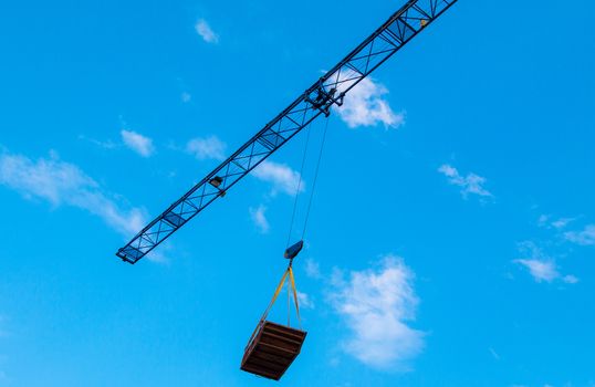 Construction site with cranes on sky background