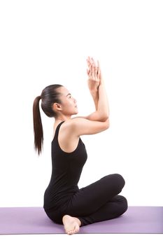 portrait of asian woman wearing black body suit sitting in yoga meditation position isolated white background