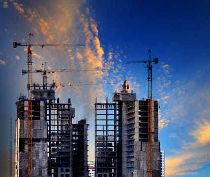 building construction site against beautiful blue sky use for construction industry and multipurpose of real estate business