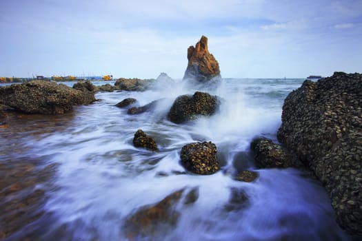 beautiful sea scape of waves splashing on rock  use for multipurpose natural background