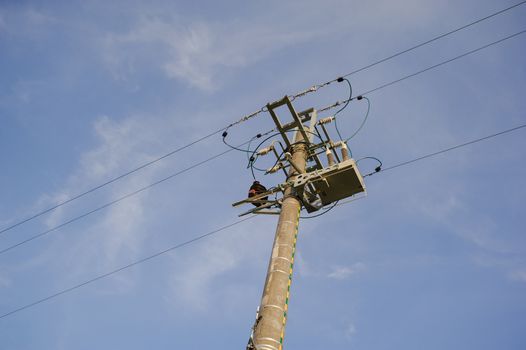 high voltage electrical pole structure on the meadow