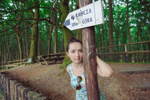 Young girl on a walk in the forest.