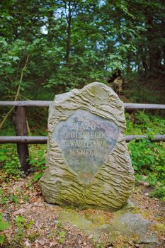 very old stone monument in the forest