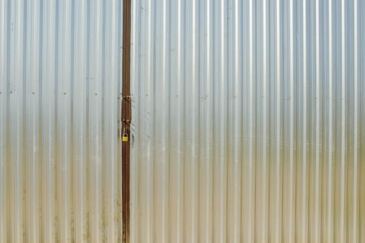 steel metal gray gate locked with padlock