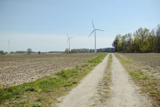 Bright blue sky moving and wind turbine.