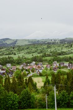 Summer mountain landscape with traditional huts in Tatra mountain.