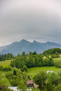 Summer mountain landscape with traditional huts in Tatra mountain.