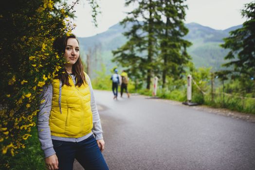 brunette woman hiker hiking on trail in summer time. Tatra mountain in Poland.