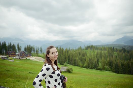 brunette woman hiker hiking on trail in summer time. Tatra mountain in Poland.