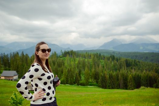 brunette woman hiker hiking on trail in summer time. Tatra mountain in Poland.