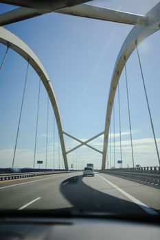 Car view over the steel bridge in summer day