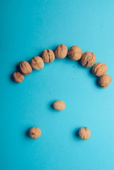 Walnuts, walnuts close-up, walnuts on a blue background