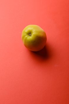 Delicious apple isolated on a red background background