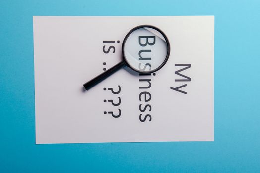 My business is word concept. Business word with business document paper on blue background. For business concept ideas background.