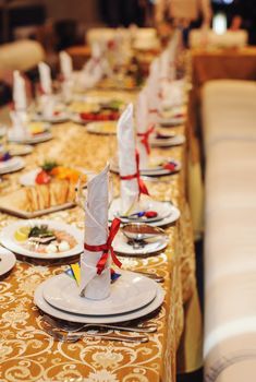 Table setting with red ribbon