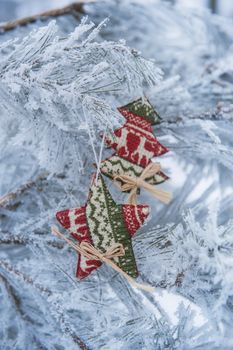 New Year's toys on a snowy tree