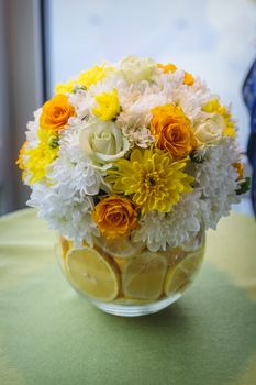 Arrangement of flowers in yellow and oranges