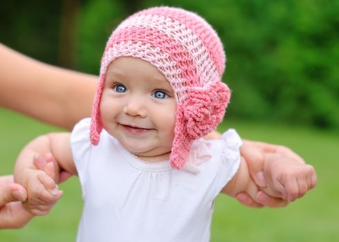 beautiful baby girl with hat smiling